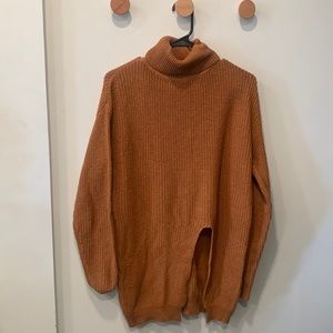 Knit burnt orange turtle neck with slit